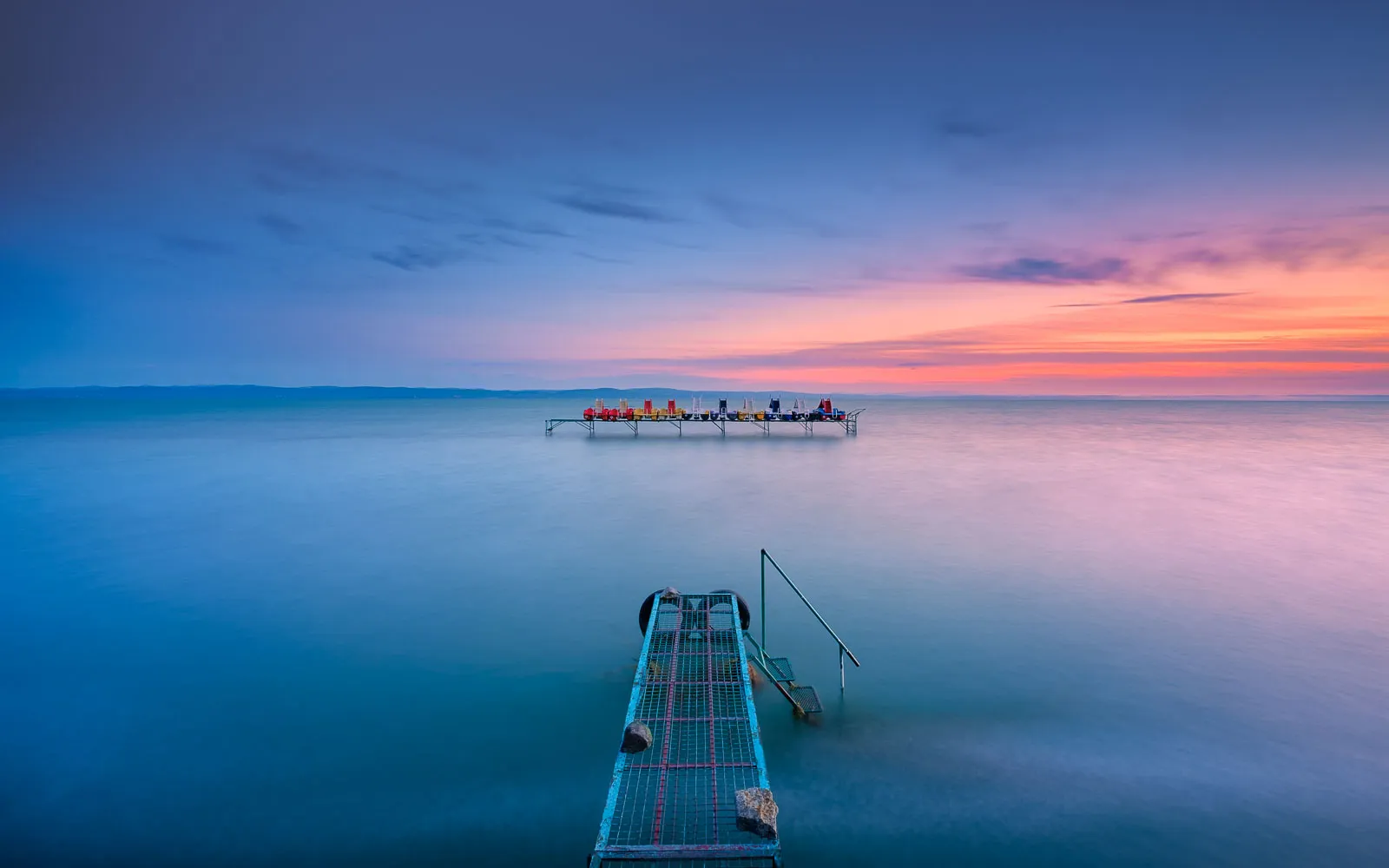 A long exposure photo taken just before sunrise of this iconic scene from Lake Balaton.